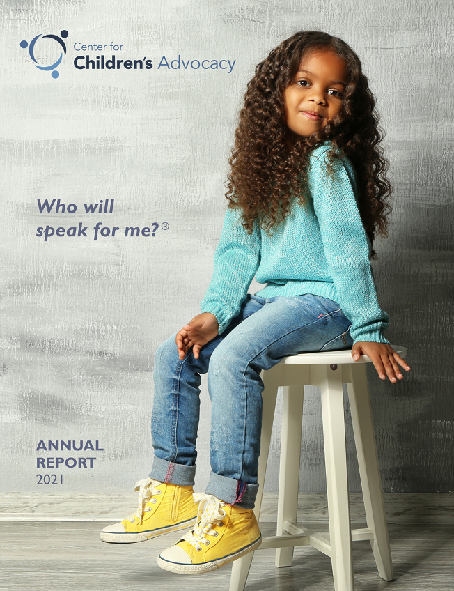 The front cover of CCA's 2021 annual report. A young girl in a turquoise shirt sits on a stool, with a determined look on her face.